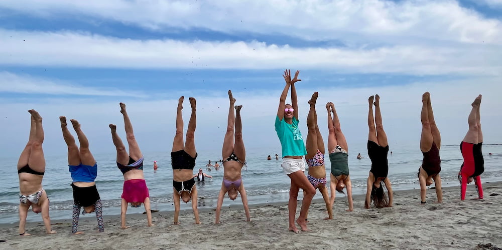 2024 The Original Adult Gymnastics Camp Beach Handstands