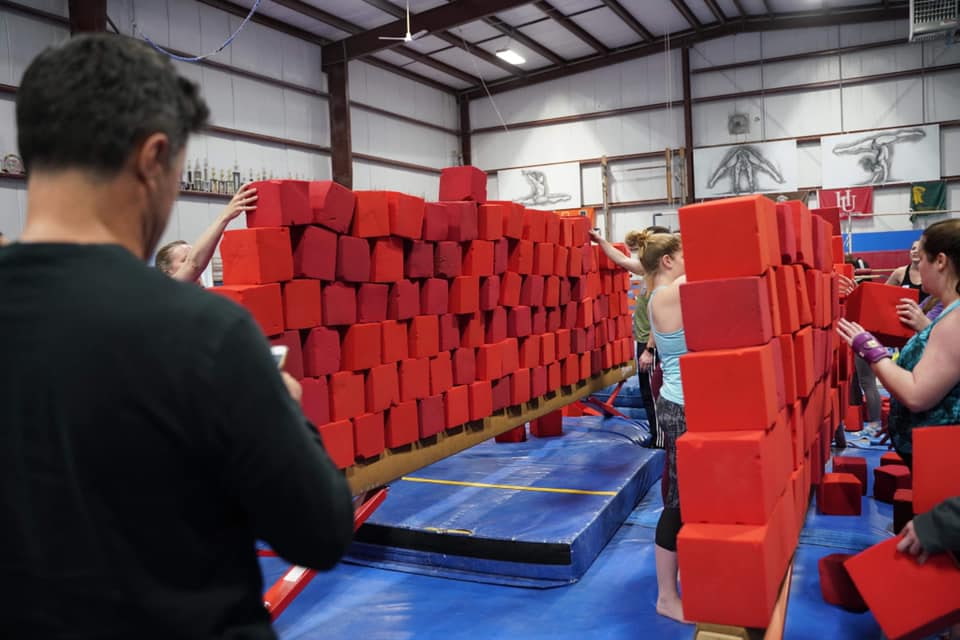 This all adult gymnastics camp includes event coaching, clinic, group activities, games, open gym, and a beach trip in the summer. all adult gymnastics camp